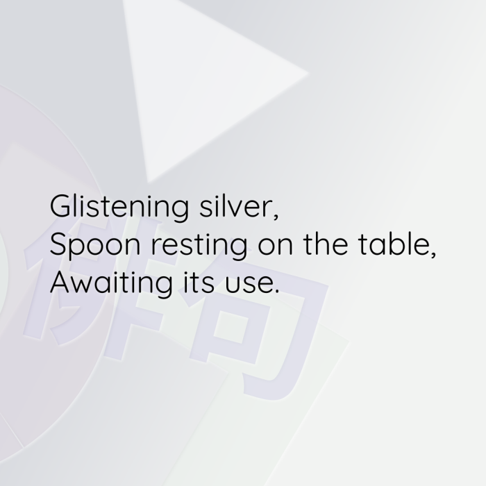 Glistening silver, Spoon resting on the table, Awaiting its use.