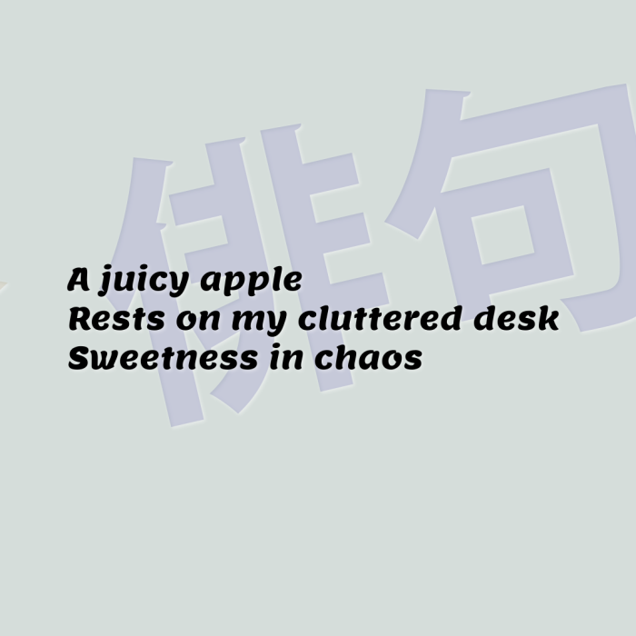 A juicy apple Rests on my cluttered desk Sweetness in chaos