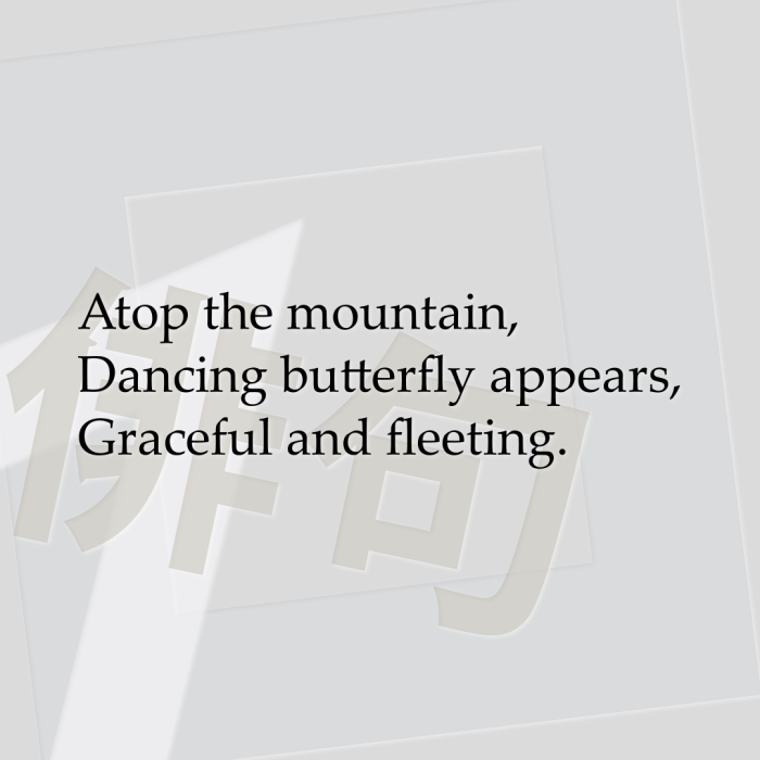 Atop the mountain, Dancing butterfly appears, Graceful and fleeting.
