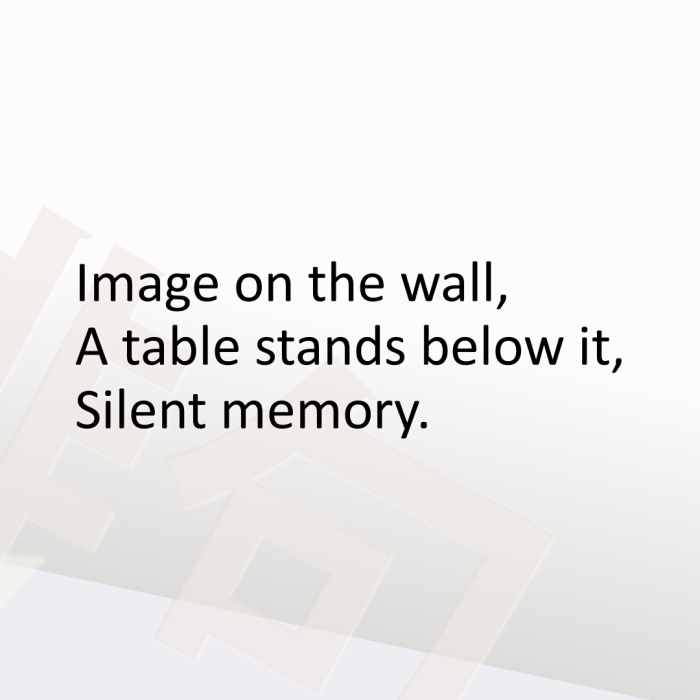 Image on the wall, A table stands below it, Silent memory.